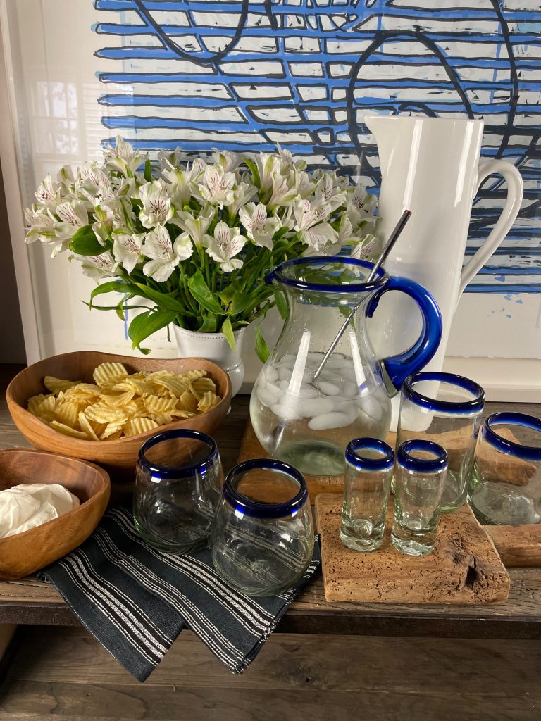 Sustainable Entertaining with Recycled Glassware and Acaciaware - Blue rimmed glassware and Acacia bowls 