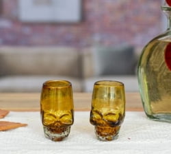 Handblown recycled glass tequila glasses, 'Amber Mexican Skull' (pair)